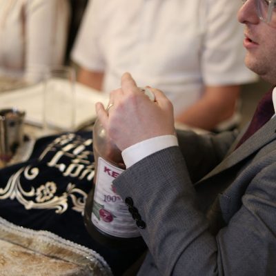 Man Preparing Wine at a Family Dinner