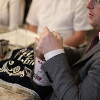 Man Preparing Wine at a Family Dinner