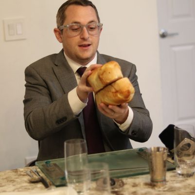 Man Holding Challah