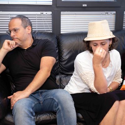 Man and Woman Sitting on Couch, Thinking and Contemplating Together