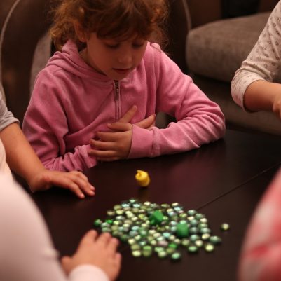 Young Girls Playing the Dreidel Game Together