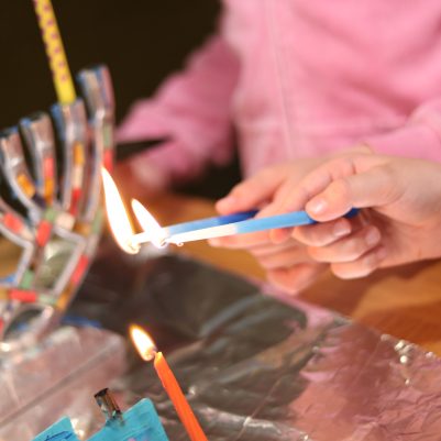 Children Celebrating by Lighting Candles Together