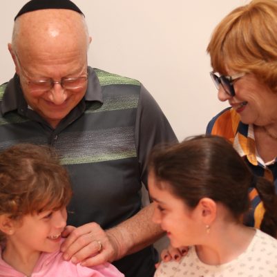 Grandparents Sharing a Warm Moment with Granddaughters