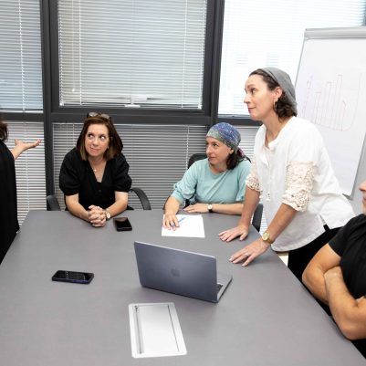 Two Women in Professional Disagreement During Team Meeting