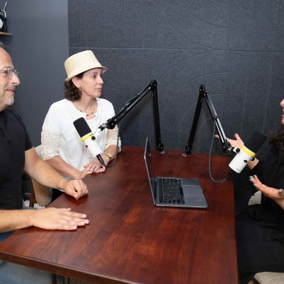Man and Two Women Recording a Podcast in Professional Studio