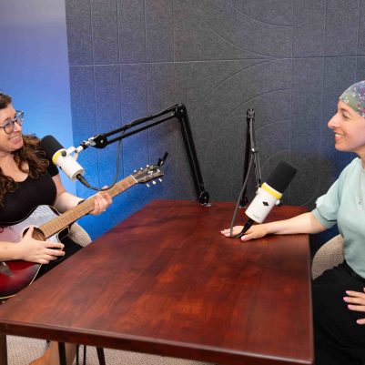 Two Women Recording a Podcast and Acoustic Music Session in Professional Studio