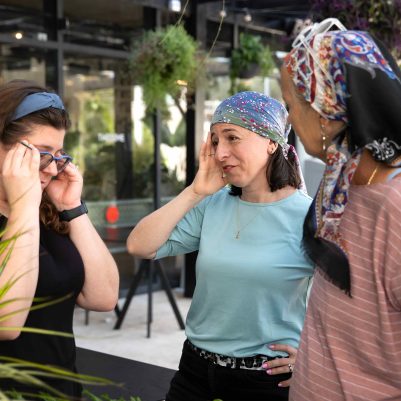 Three Women Having a Stressful Conversation in an Outdoor Garden