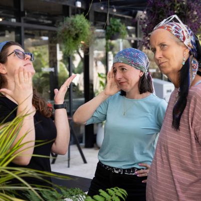 Three Women Talking About a Stressful Story in an Outdoor Space